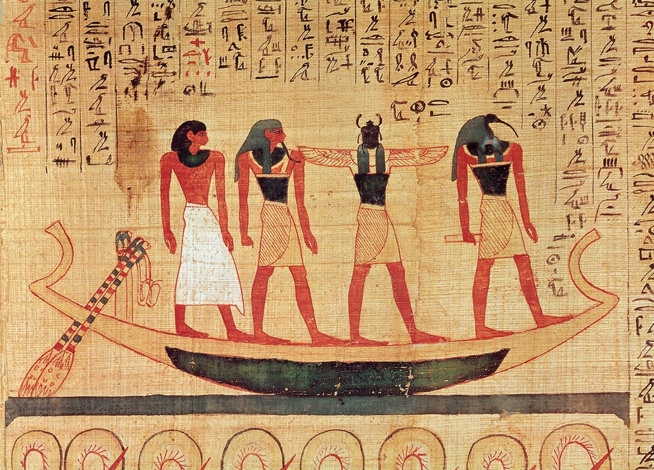 Papyrus depicting a man being transported on a barque to the afterlife by Thoth, Khepri and another god, Mythological papyrus of Imenemsaouf, Third Intermediate Period, c.1000 BC. Photo credit Bridgeman Images.