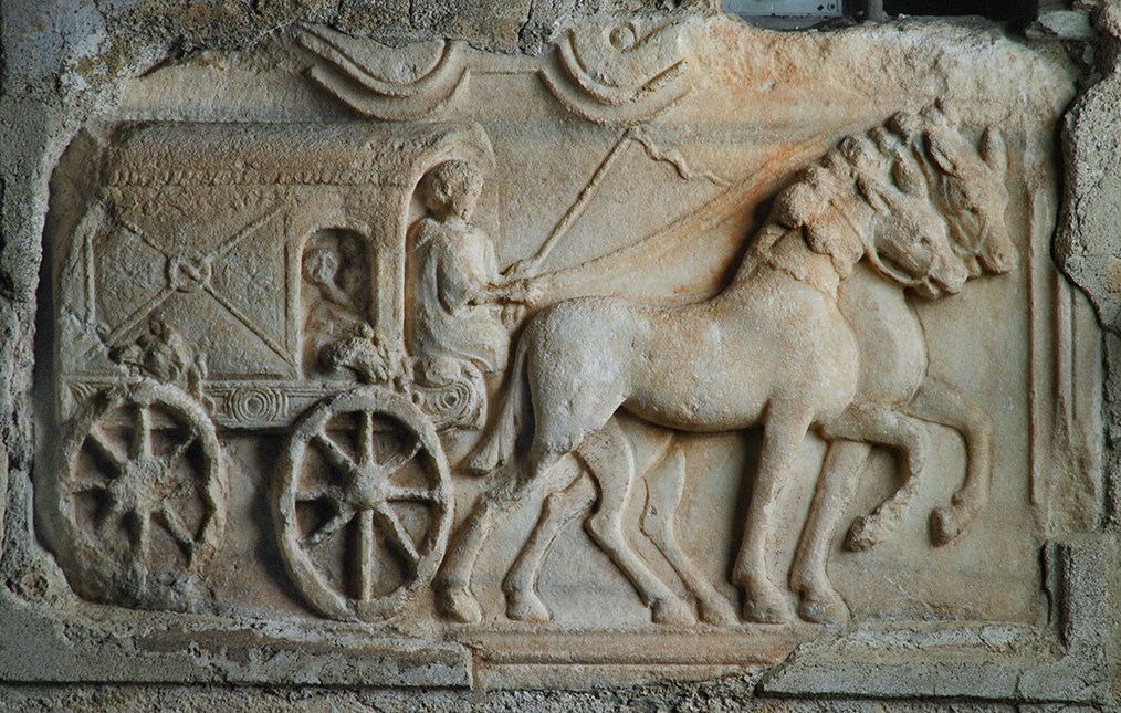 A relief depicting a carruca, a four-wheeled carriage drawn by two horses. Using a carruca was a rather comfortable way of travelling: the carriage body was suspended on leather straps - a kind of shock absorber. For long journeys carrucae were even provided with beds.  https://twitter.com/DrNWillburger/status/1496403318251438082